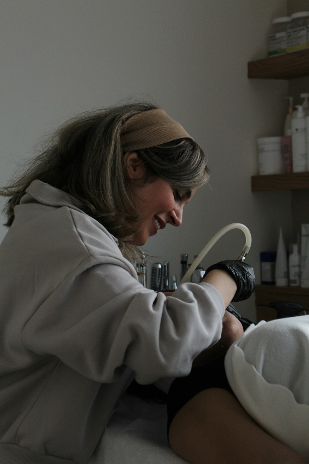 a-woman-in-a-hospital-bed-getting-her-foot-examined-7xsjzgpzf2a